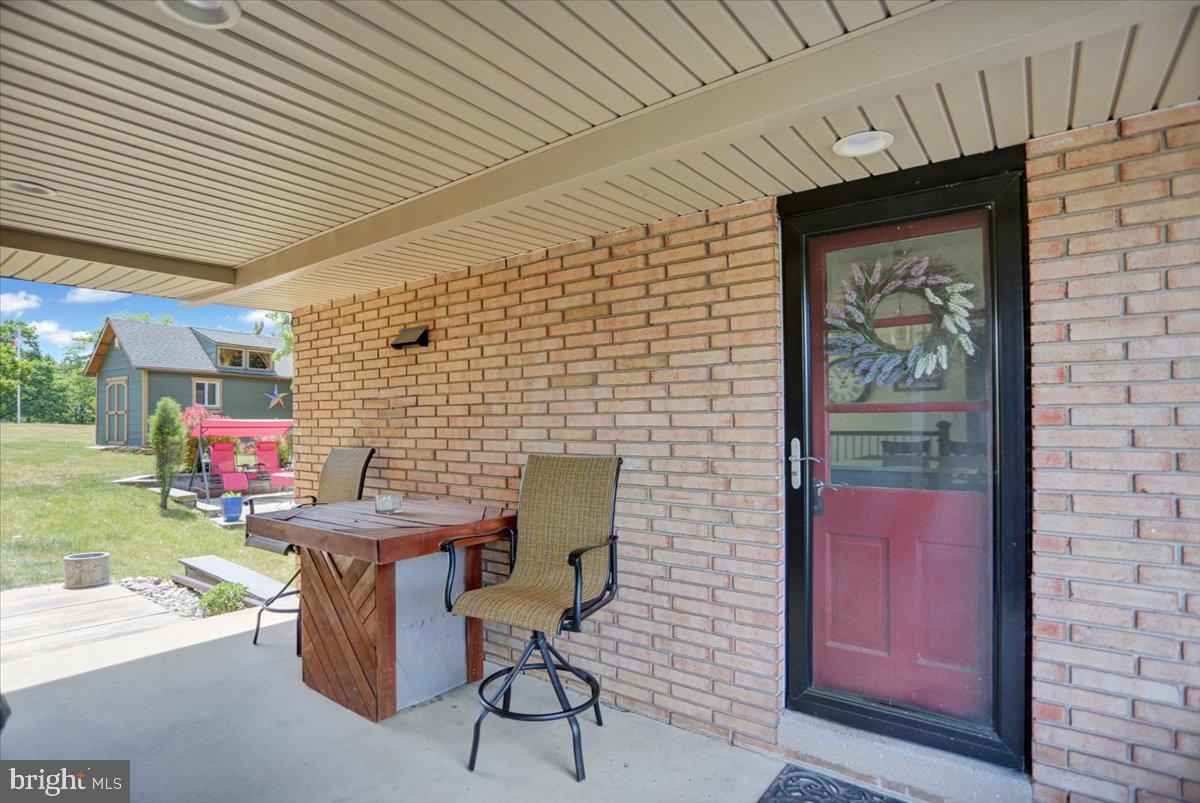 692 Brownsville Road Reading, PA 19608 - Photo 3 of 43 a brick building with a table and chairs