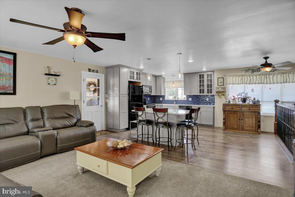 692 Brownsville Road Reading, PA 19608 - Photo 6 of 43 a living room with furniture kitchen area and a chandelier
