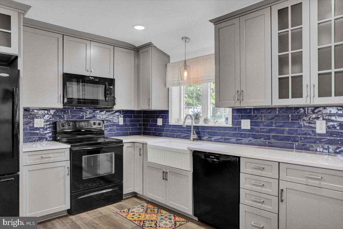 692 Brownsville Road Reading, PA 19608 - Photo 8 of 43 a kitchen with granite countertop white cabinets stainless steel appliances and a sink