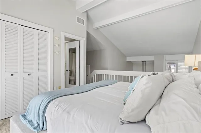 a view of a bedroom with a bed