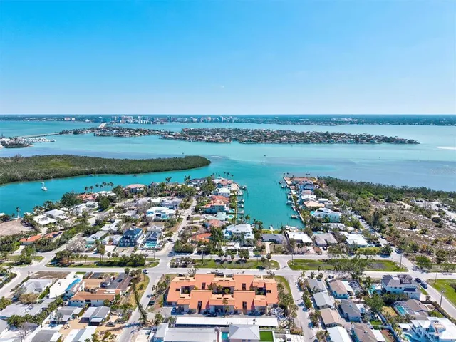 an aerial view of a city with ocean view