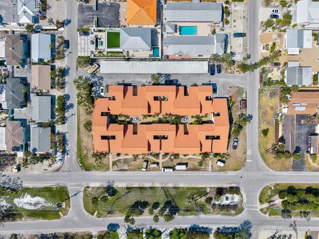 a view of a chairs and table in a backyard