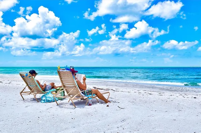 a front view of multi story residential apartment building with yard