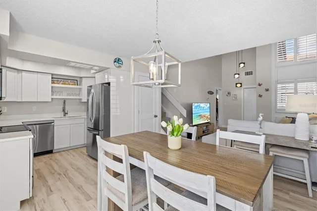 a kitchen with a table and chairs