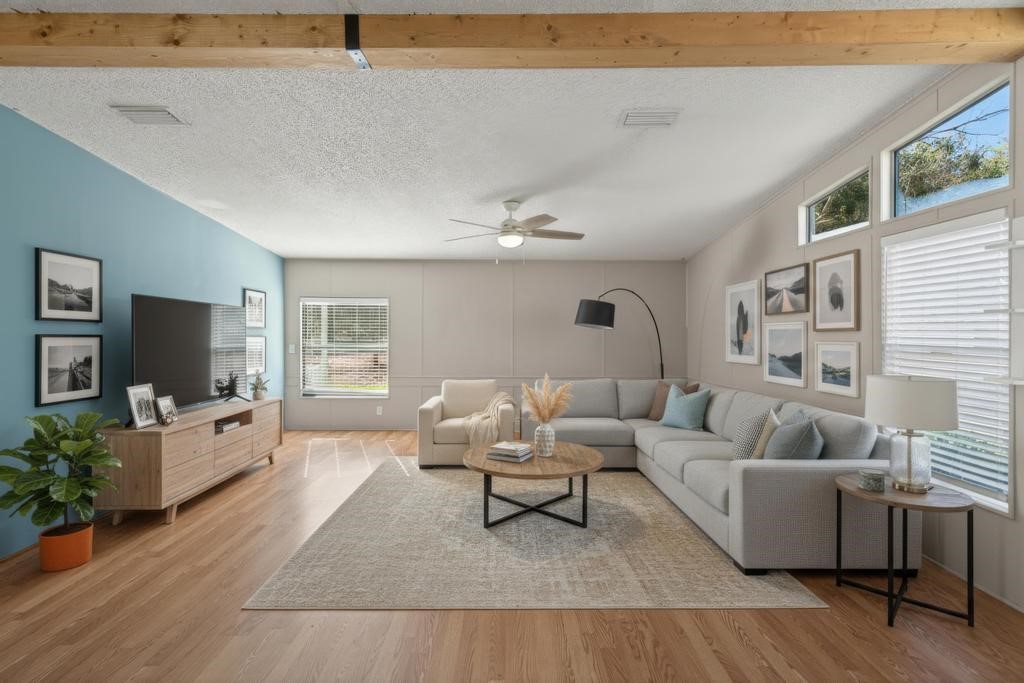 2744 Roy Sikes Road Hilliard, FL 32046 - Photo 39 of 97 a living room with furniture and a flat screen tv