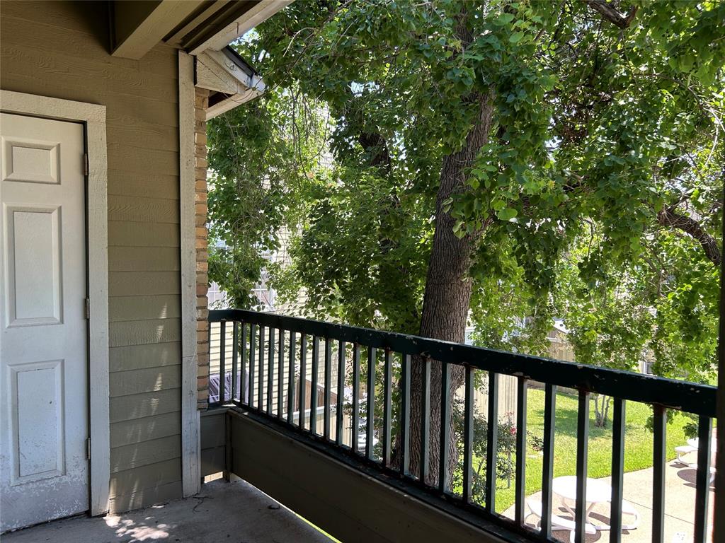 4107 Esters Road Irving, TX 75038 - Photo 12 of 21 Private balcony with concrete flooring and dark-finish metal railing