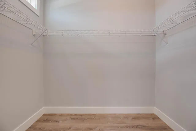a view of an empty walk in closet