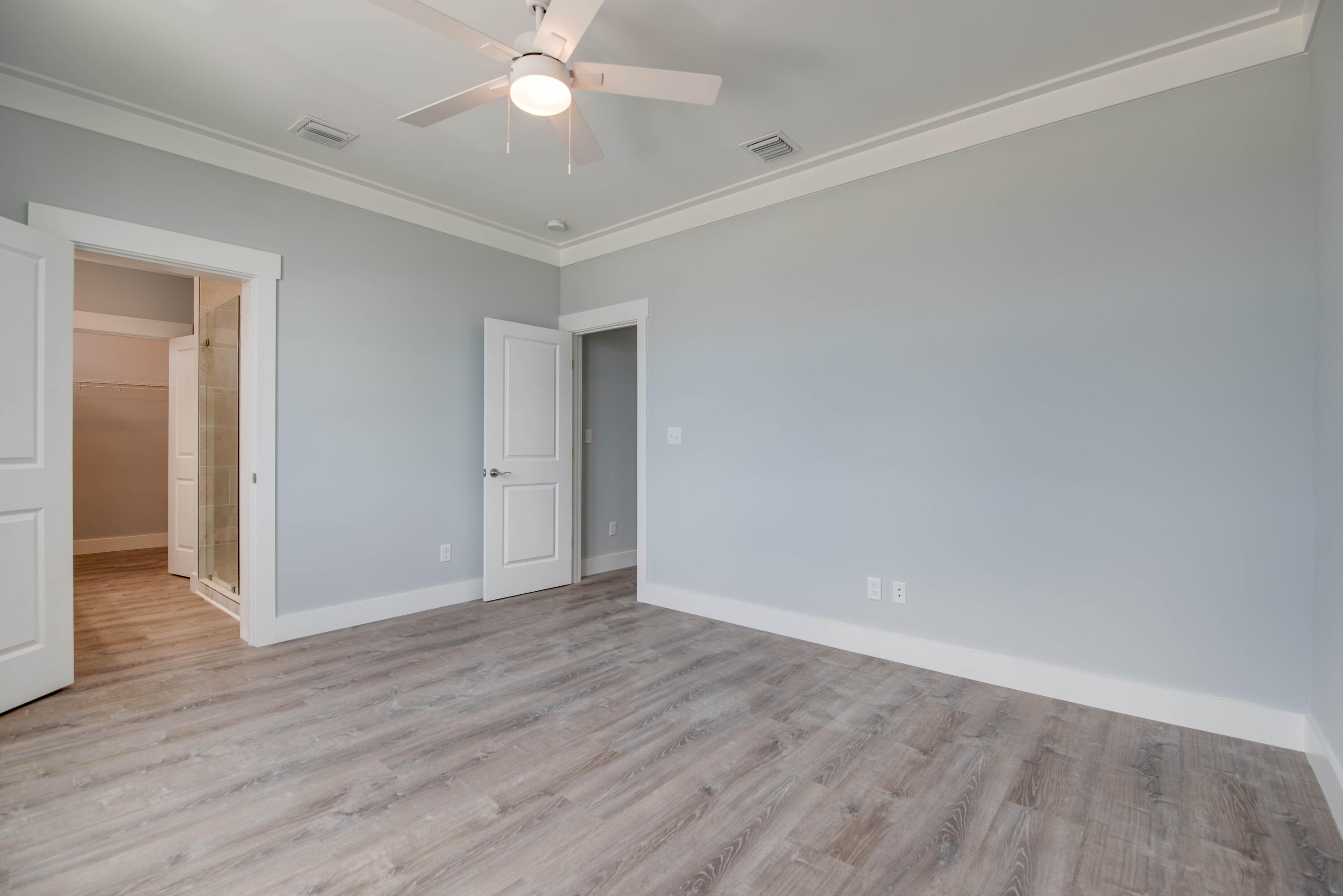 29558 Ranger Avenue Big Pine Key, FL 33043 - Photo 14 of 19 a view of an empty room with wooden floor