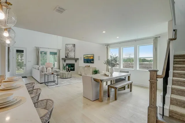 a room with furniture pool table and windows