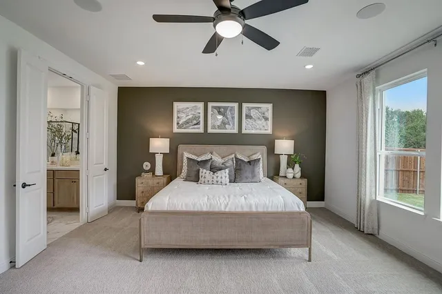 a kitchen with stainless steel appliances granite countertop a stove a refrigerator a oven a sink with a dining table and chairs