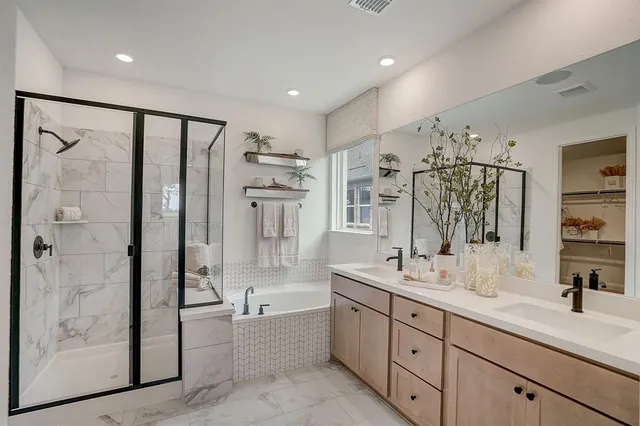 a kitchen with kitchen island granite countertop a sink stainless steel appliances and cabinets
