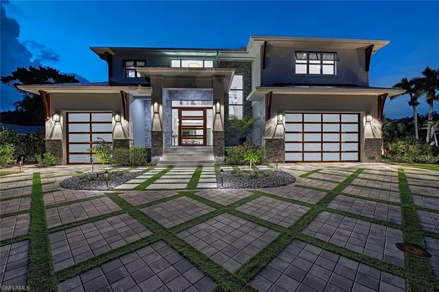 a front view of a house with garden