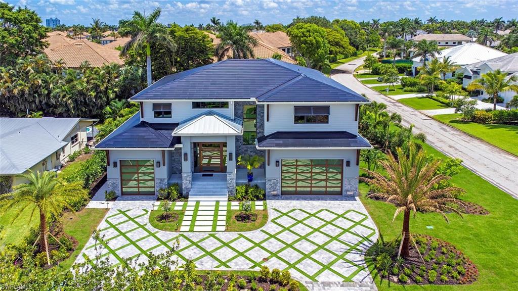 a front view of a house with garden