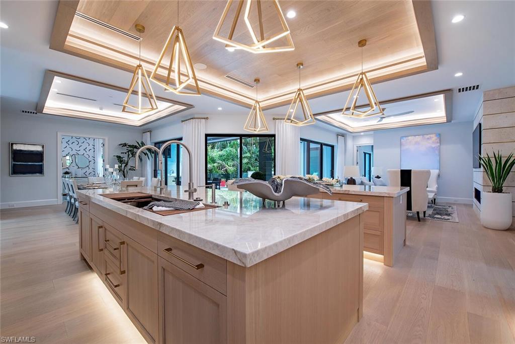 655 Parkview Lane Naples, FL 34103 - Photo 13 of 37 a kitchen with a stove and a table