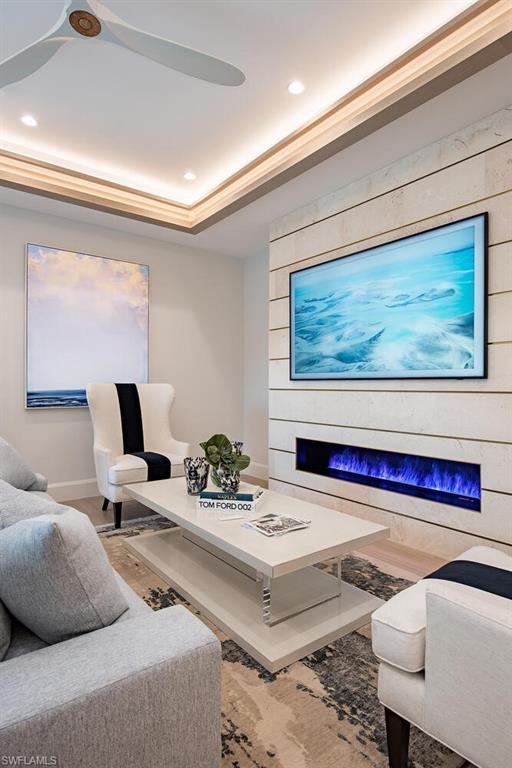 655 Parkview Lane Naples, FL 34103 - Photo 15 of 37 a living room with furniture and a potted plant