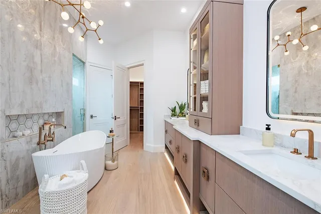 a large bathroom with a double vanity sink a mirror and a shower