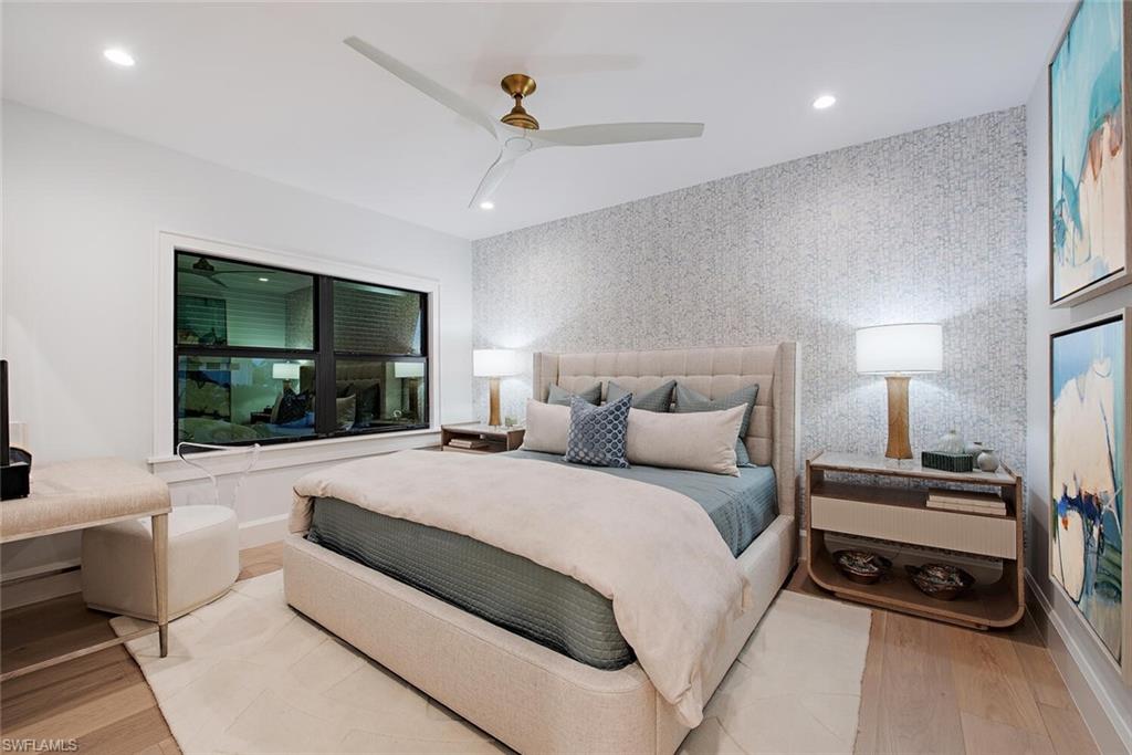 655 Parkview Lane Naples, FL 34103 - Photo 24 of 37 a large bedroom with a bed and a window