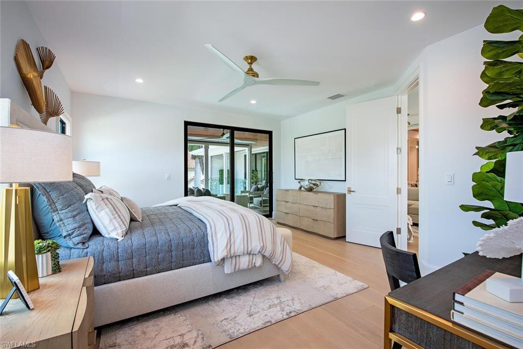 655 Parkview Lane Naples, FL 34103 - Photo 26 of 37 a living room with furniture and a potted plant