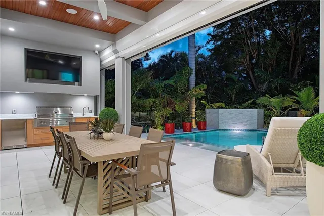 a outdoor dining space with furniture and garden view