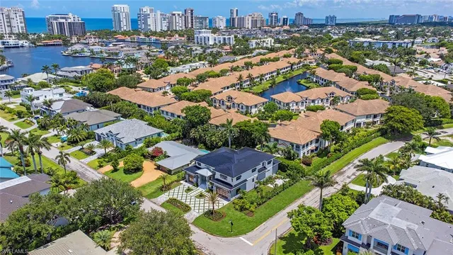 an aerial view of residential houses with outdoor space