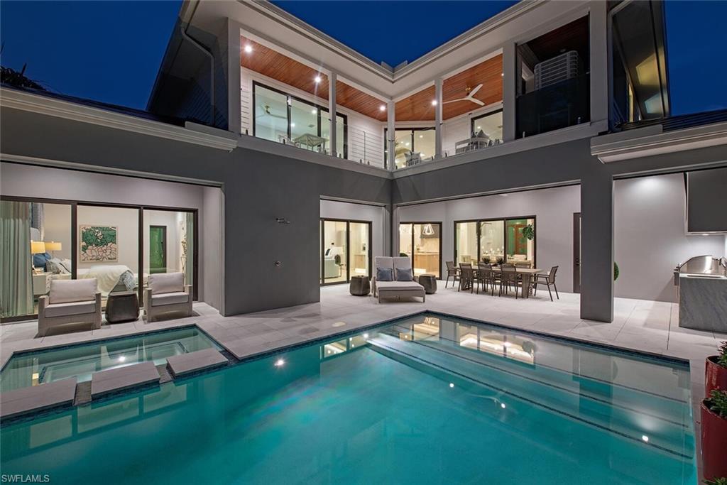 655 Parkview Lane Naples, FL 34103 - Photo 34 of 37 a view of living room and hall with furniture