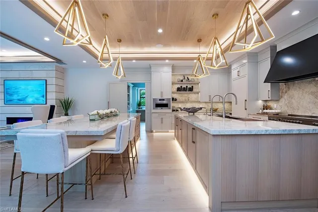 a large kitchen with a table and chairs