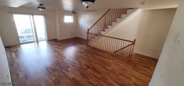 a view of entryway with wooden floor