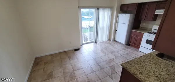 a view of a kitchen from the hallway