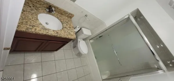 a bathroom with a mirror and vanity