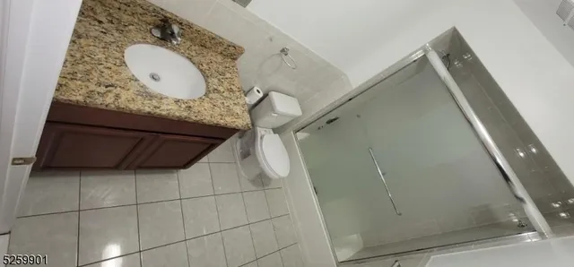 a bathroom with a mirror and vanity