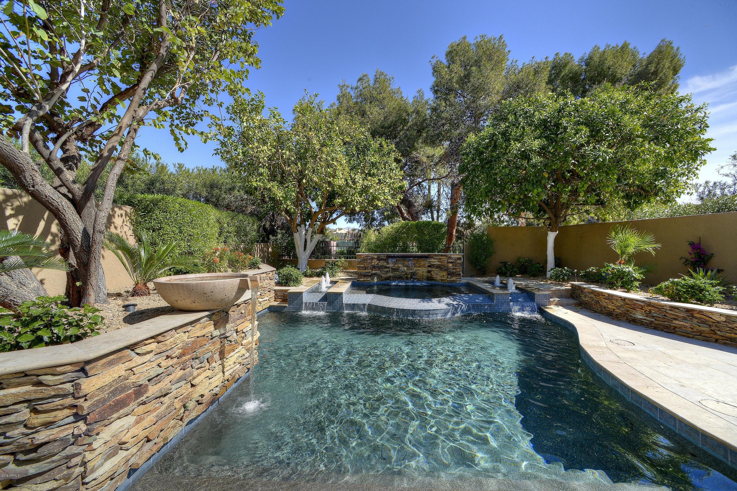 7740 East Gainey Ranch Road, Unit 58 Scottsdale, AZ 85258 - Photo 17 of 27 a view of a backyard with couches and potted plants