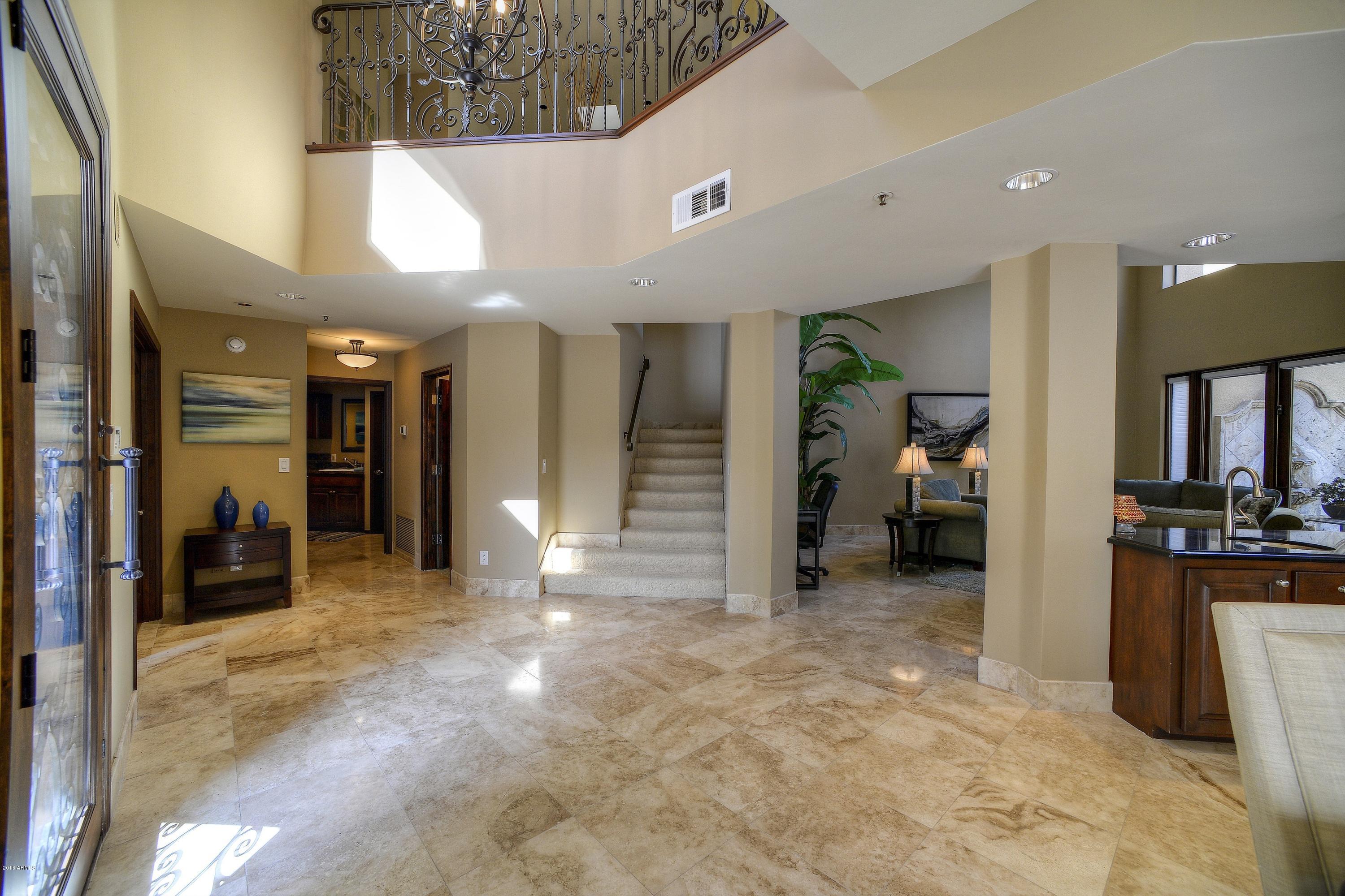 7740 East Gainey Ranch Road, Unit 58 Scottsdale, AZ 85258 - Photo 8 of 27 a view of a hallway with livingroom and furniture