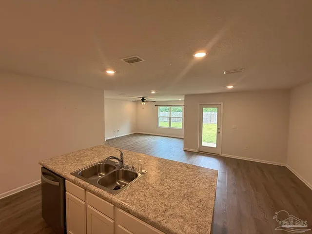 a kitchen with a sink and cabinets