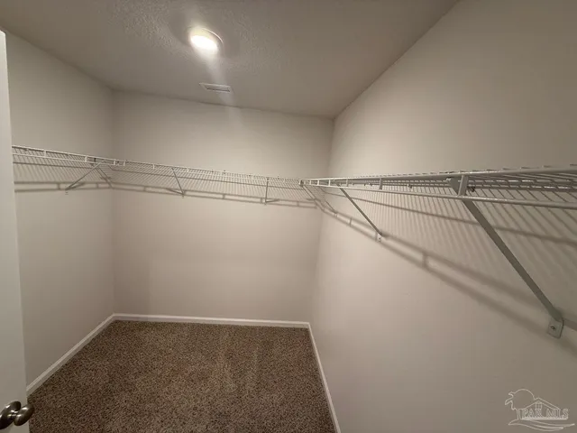 a view of a room with racks on the wall