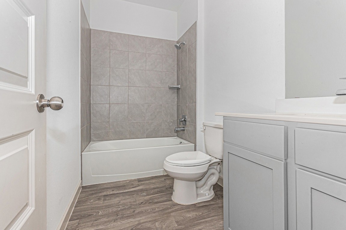 31 Desert Spring Lane Manvel, TX 77578 - Photo 4 of 10 a bathroom with a sink toilet a mirror and shower