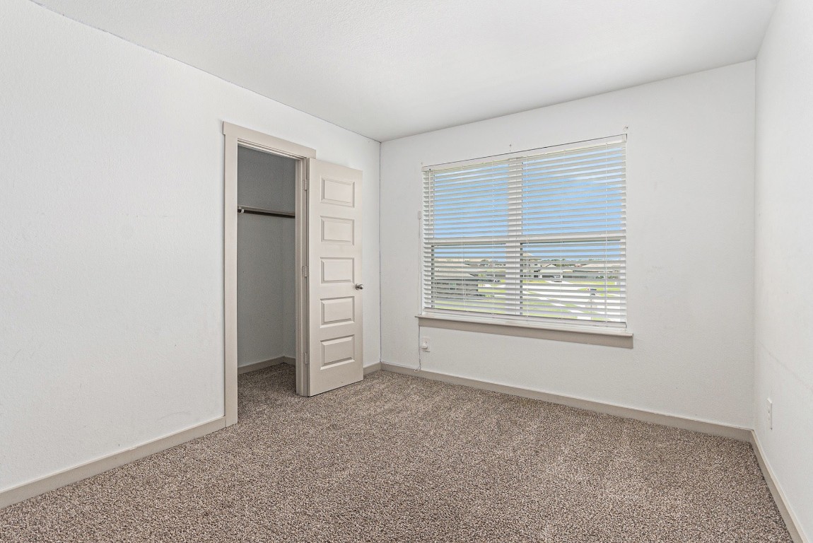 31 Desert Spring Lane Manvel, TX 77578 - Photo 10 of 10 a view of an empty room with a window
