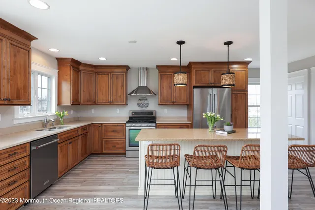 a kitchen with granite countertop a sink and cabinets