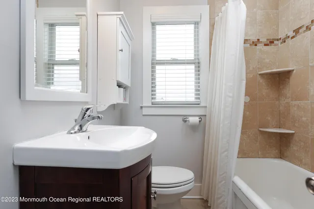 a bathroom with a sink a toilet and a bathtub