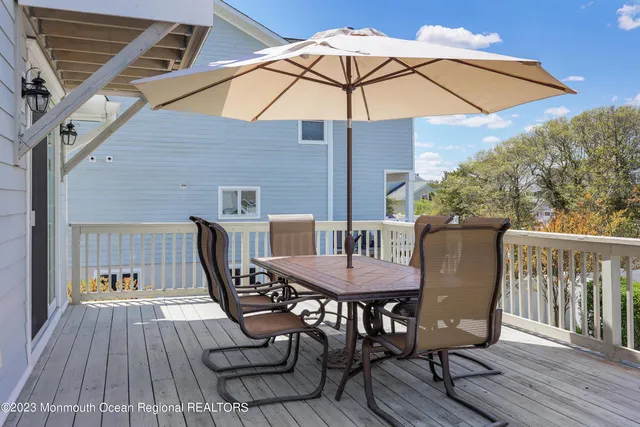 a view of balcony with furniture and wooden floor