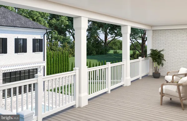 a view of a two chairs and table in the balcony