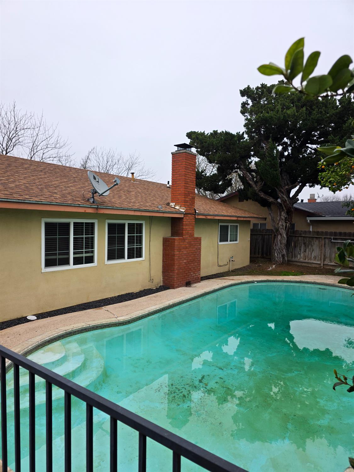1624 Falmouth Way Modesto, CA 95355 - Photo 23 of 26 a front view of a house with a garden