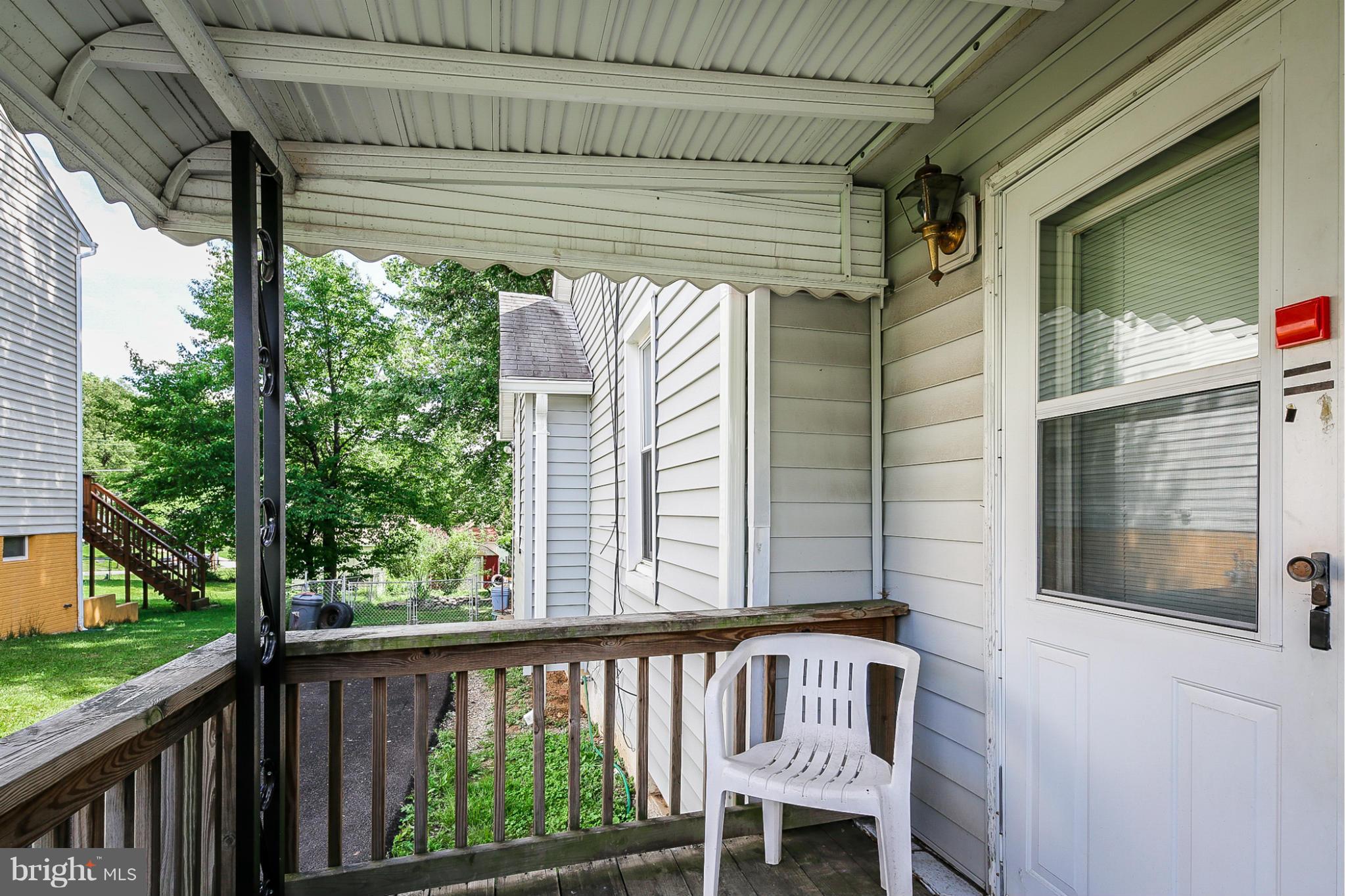 4117 Old Washington Road Baltimore, MD 21227 - Photo 21 of 27 a view of a porch with furniture and a gate