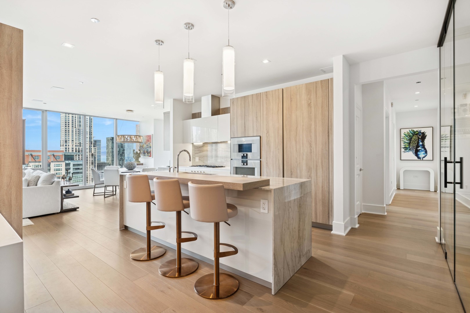 363 East Wacker Drive, Unit 2606 Chicago, IL 60601 - Photo 16 of 68 a kitchen with stainless steel appliances kitchen island granite countertop a refrigerator and a sink
