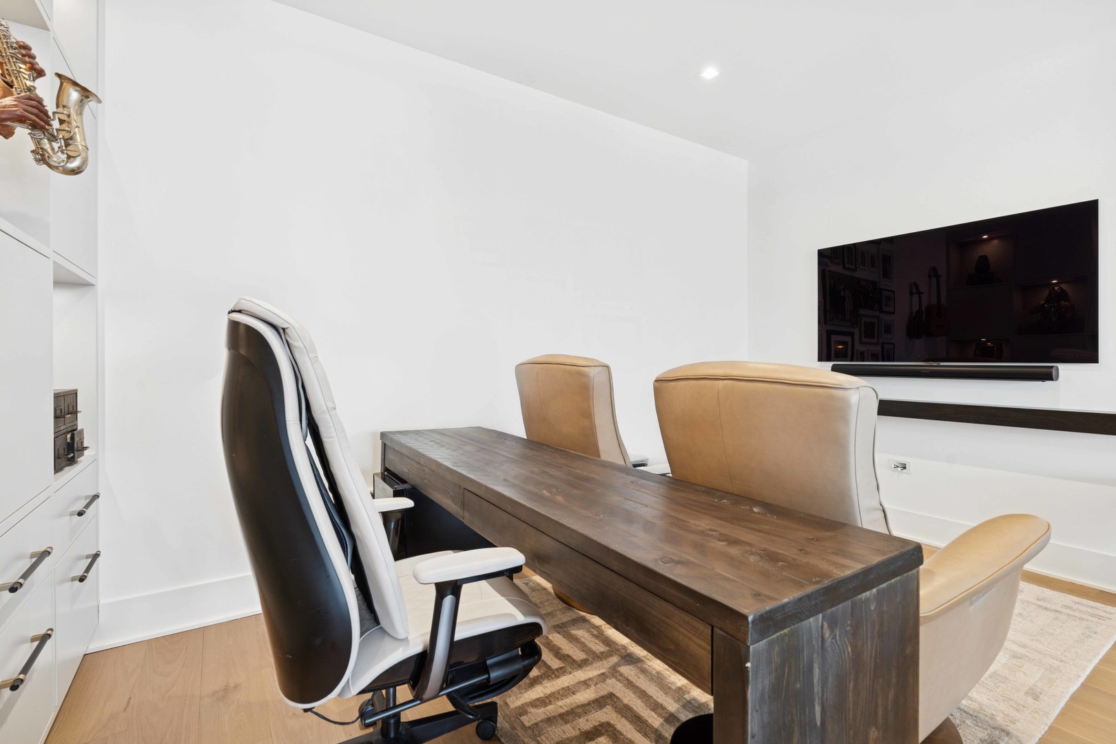 363 East Wacker Drive, Unit 2606 Chicago, IL 60601 - Photo 26 of 68 a view of a workspace with furniture and wooden floor