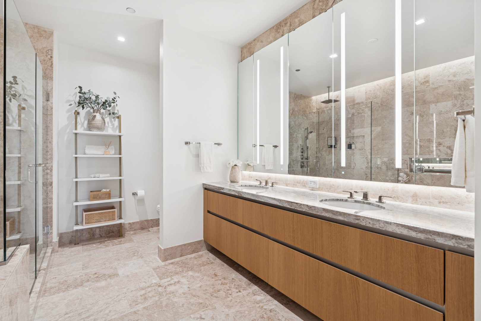 363 East Wacker Drive, Unit 2606 Chicago, IL 60601 - Photo 31 of 68 a bathroom with a double vanity sink a mirror and a shower