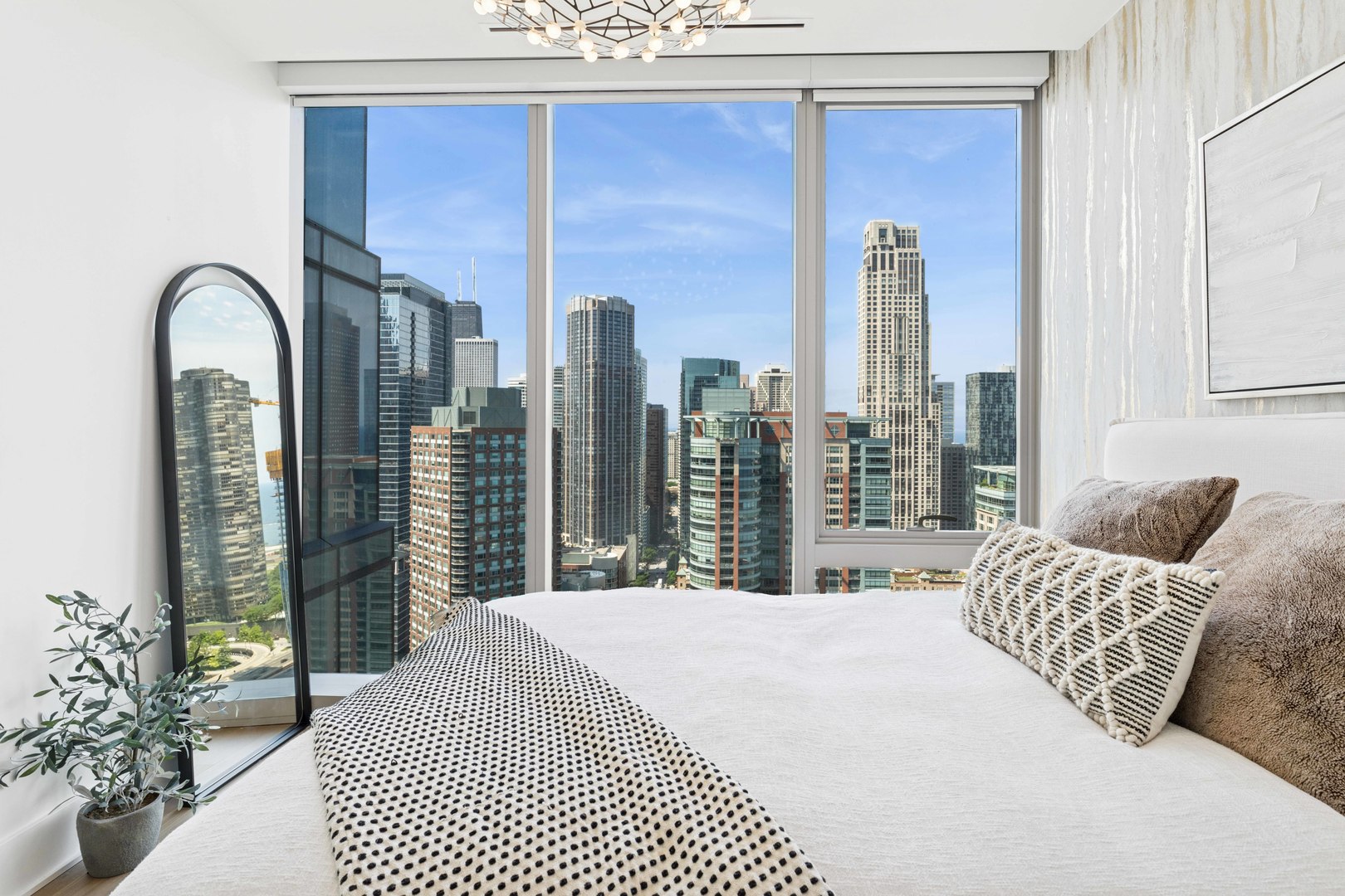 363 East Wacker Drive, Unit 2606 Chicago, IL 60601 - Photo 35 of 68 a bedroom with a large bed and a large window