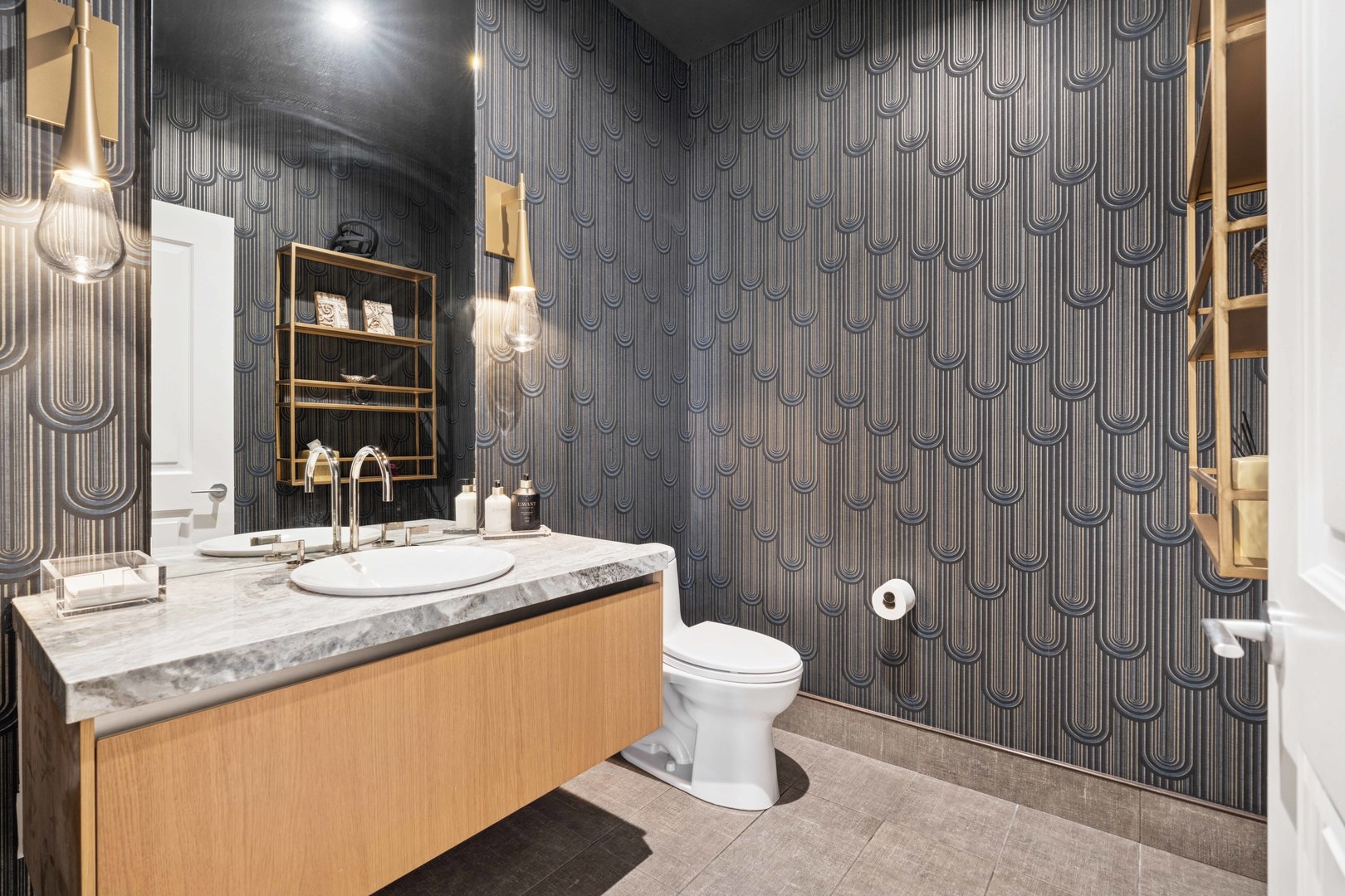 363 East Wacker Drive, Unit 2606 Chicago, IL 60601 - Photo 39 of 68 a bathroom with a granite countertop sink a toilet and shower