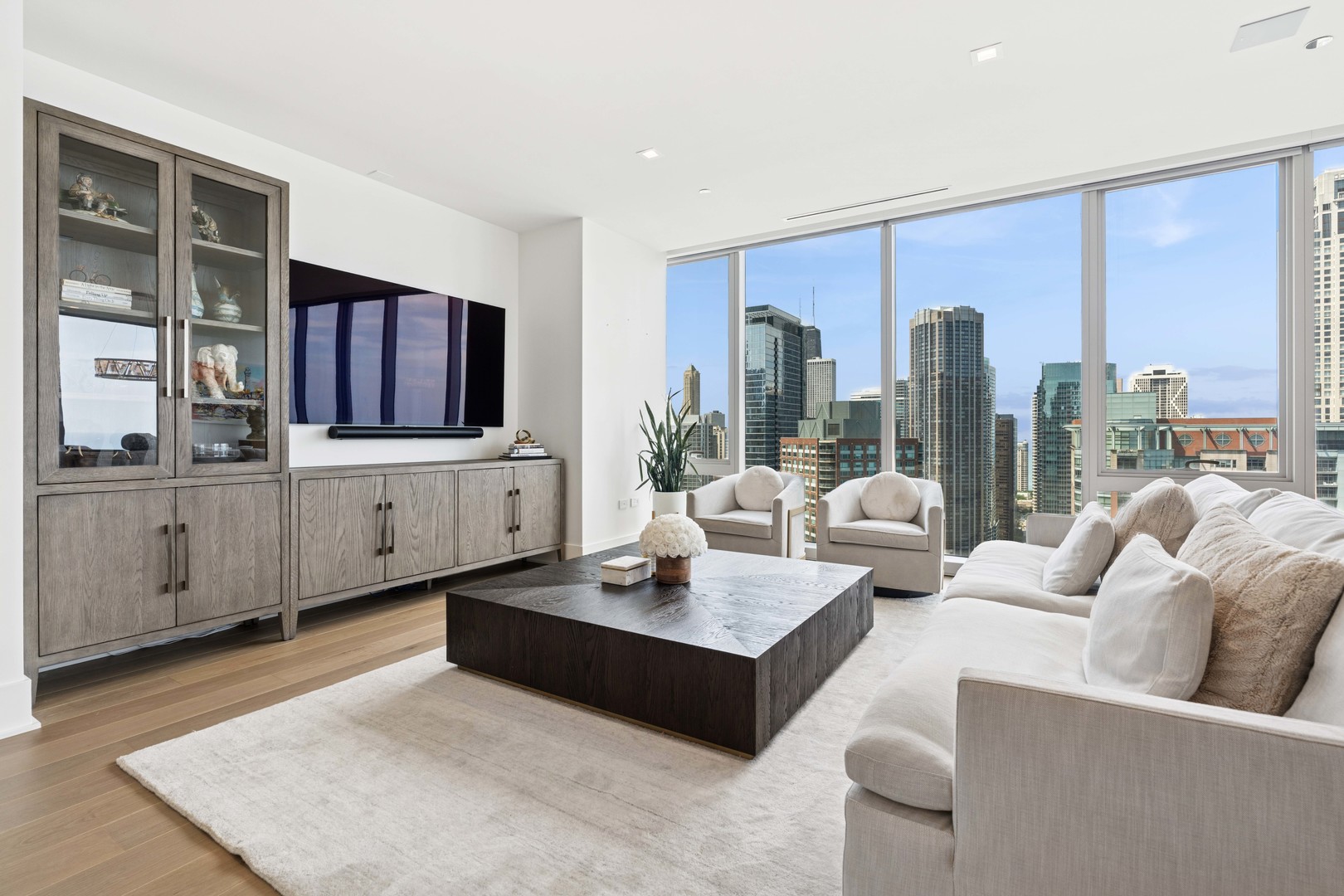 363 East Wacker Drive, Unit 2606 Chicago, IL 60601 - Photo 7 of 68 a living room with fireplace furniture and a large window