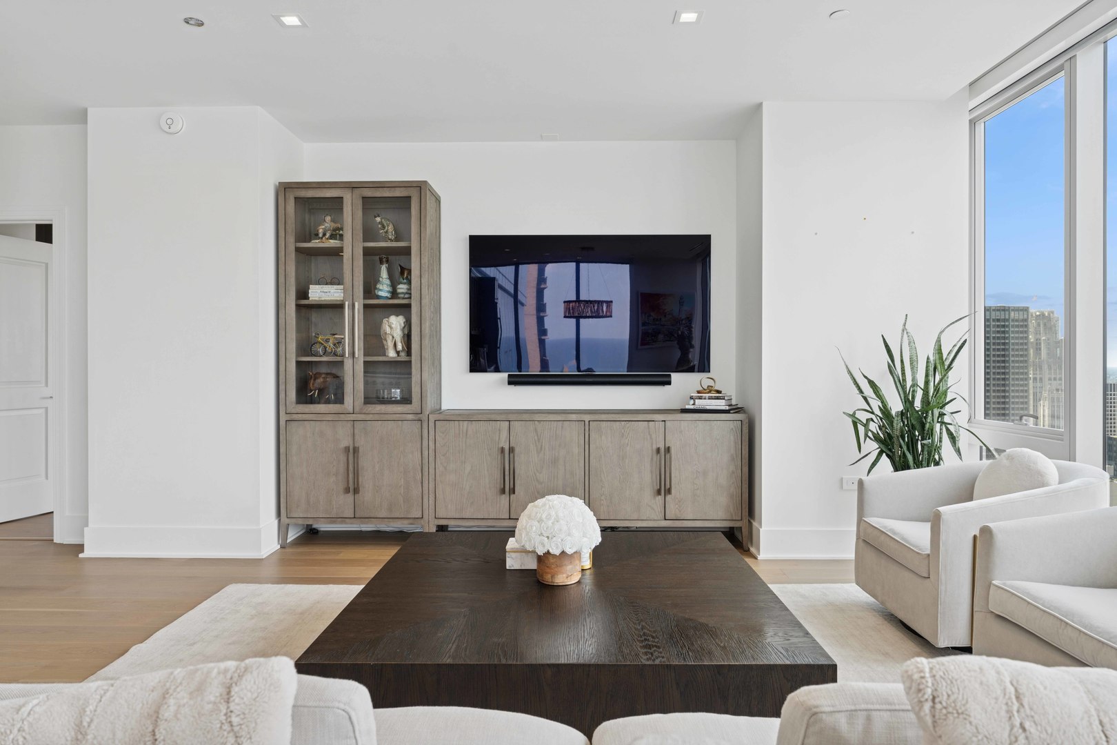 363 East Wacker Drive, Unit 2606 Chicago, IL 60601 - Photo 8 of 68 a living room with furniture potted plant and a table