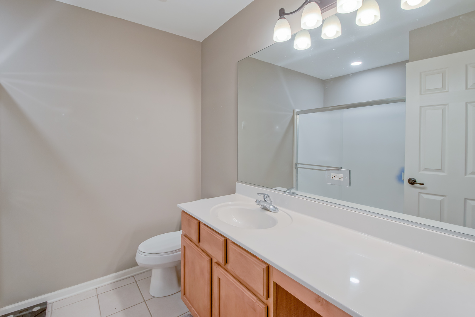 2305 Summerlin Drive Aurora, IL 60503 - Photo 13 of 22 a bathroom with a sink a toilet and shower